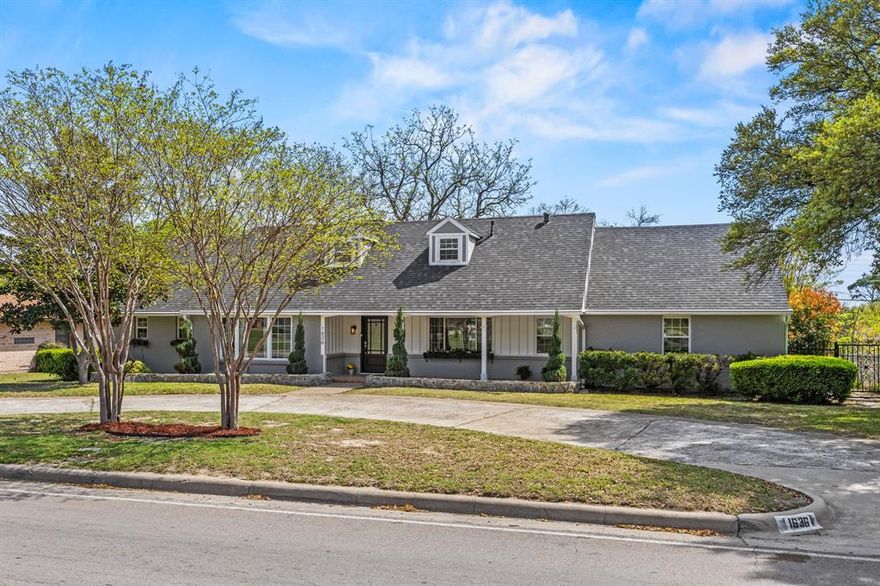 Stunningly renovated two story home situated on an impressive 100 foot wide, third acre lot in one of Oak Cliffs most sought after neighborhoods, Wynnewood Hills. This well established, tree lined community sits adjacent to The Golf Club of Dallas and is known for its custom homes on expansive lots. From the moment you arrive, the circular drive and stately curb appeal set the tone. Inside, richly stained hardwood floors flow throughout the home, creating warmth and timeless style. The beautifully updated kitchen is the centerpiece of the home’s functional layout, featuring quartz countertops, stainless steel appliances, a natural gas range with designer vent hood, apron-front farm sink, wine fridge, and a large island ideal for casual dining and entertaining. Enjoy the flexibility of two potential primary suites, one upstairs and one downstairs, both offering ensuite baths and walk in closets. The formal living area at the front of the home provides versatile space that can easily serve as a home office, dining room, or additional living area to fit your needs. A warm and inviting family room designed for comfort and relaxation features rich wood flooring and a cozy wood burning fireplace. Large windows fill the room with abundant natural light, enhancing the open, airy feel and creating a bright yet tranquil atmosphere, ideal for unwinding or spending quality time with family and friends. The spacious backyard is perfect for entertaining, offering three distinct outdoor areas and plenty of yard area, providing ample space for your family and friends gathering events. A rear entry two car garage provides added convenience and vehicle protection from Texas weather. Ideally located with quick access to Highway 67 and I35, you’re just minutes from downtown Dallas, Bishop Arts District, and Oak Cliffs new 5 acre Halperin Park. Don’t miss this exceptional opportunity to own a beautifully updated home in the heart of Oak Cliff!