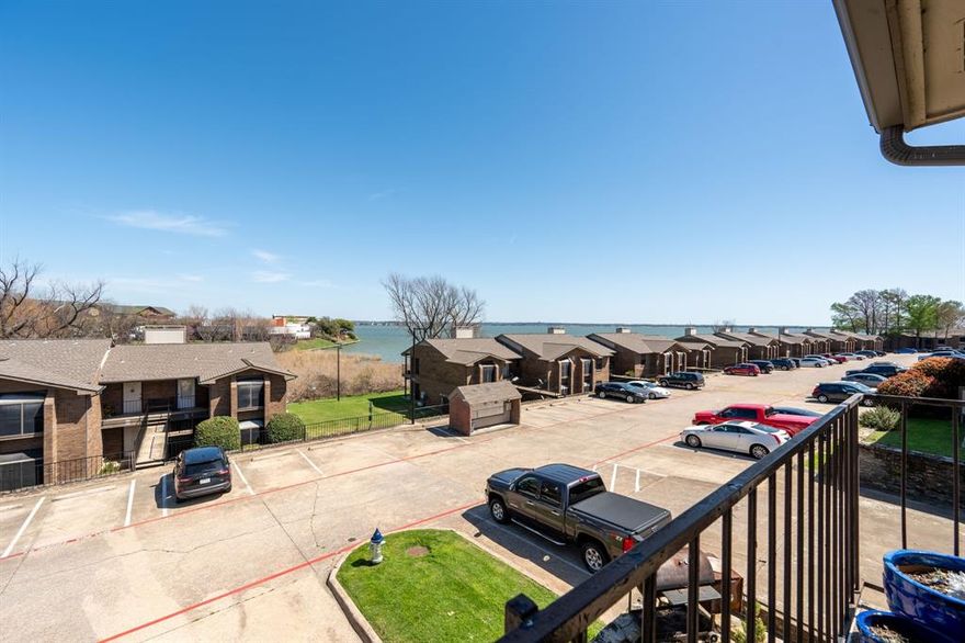 This 1 bedroom, 1 bath condo offers everything you want along with an amazing view of the lake from the covered balcony. Inside, you’ll find an updated kitchen with granite counter tops, upgraded flooring, and dining area. The living room is anchored by a charming wood burning fireplace and opens to sliding glass doors that lead directly to the covered balcony with storage unit. The bathroom has been remodeled with a large walk in shower, vanity, fixtures and more. This condo is ideal as a primary residence, weekend retreat, or a potential income-producing property. Community amenities include two swimming pools and gated entrances. Located near marinas, dining, shopping, HWY 30, George Bush Tollway and Bass Pro Shops. Owner financing available with 10% down, 6% interest, length of loan based on last 2yrs of tax returns.
