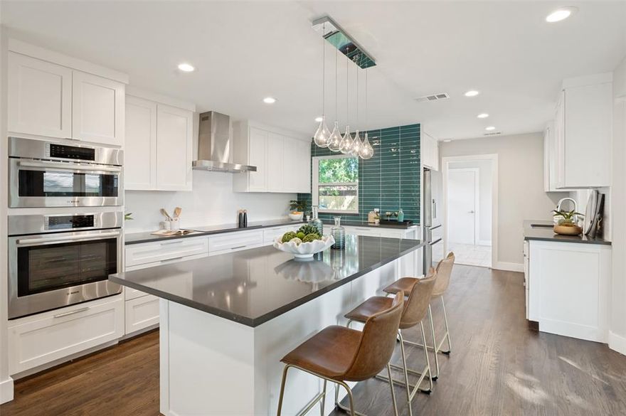 Welcome to this beautifully updated home where thoughtful design, modern upgrades, and abundant natural light come together seamlessly. With approximately 20 windows—including three stunning picture windows and glass-paneled doors—the home is filled with warmth and sunshine.
The chef-inspired kitchen features custom-built cabinetry designed to maximize space, with lower cabinets configured as easy-access drawers. Premium Bosch appliances include an induction cooktop (a cleaner, more efficient alternative to gas), a versatile convection microwave that doubles as a second oven, and a counter-depth French door refrigerator. Quartz countertops, a spacious island perfect for gathering, a large single-basin sink, and a motion-sensor faucet complete the space.
The home offers three generously sized bedrooms with ample storage and flexible living areas enhanced by two pocket doors for added versatility. The primary suite features a large walk-in shower and elegant marble countertops.
Major updates provide peace of mind, including HVAC, roof, appliances, and electrical panel (all 2019), plus updated plumbing in the kitchen, bathrooms, and laundry. Additional improvements include an encapsulated crawl space with dehumidifier, French drain, and sump pump, as well as an attic furnace with updated ductwork.
Freshly refinished hardwood floors, updated lighting, and a separate laundry room add to the home’s appeal. Outside, a mature live oak tree and a mix of native and ornamental landscaping create inviting curb appeal.
A perfect blend of style, function, and key updates—this home is move-in ready.