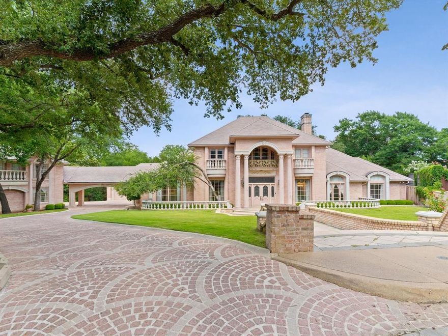 Welcome to one of the most nostalgic and architecturally rich homes in all of Dallas—tucked on nearly an acre in Preston Hollow. With a sprawling 9,775 square feet, this estate offers timeless grandeur, old-world elegance, and an opportunity to own a true legacy property. From the moment you enter, you’re greeted by dramatic columns, intricate millwork, and a sweeping staircase designed around a hand-forged railing imported from France. Every detail, from the intricate plasterwork to the globally-sourced stone and tile, reflects a level of craftsmanship and vision rarely seen today; it's obvious that no expense was spared in bringing this vision to life. This home was built to host, imagine welcoming guests into the grand ballroom, sipping wine from the oversized wine cellar tucked below in the basement, or entertaining across multiple indoor and outdoor living spaces. The main house features an elevator, basement storm shelter, beauty salon, circular mirrored fitting area designed for custom tailoring with private changing room, enormous cedar closet, and so much more... Additionally find two detached living quarters; A two-bedroom garage apartment complete with an elevator, a full kitchen, living room, perfect for long-term guests or extended family. A separate ground-level studio apartment with its own kitchen, laundry and bath—ideal for staff, extended family or a child's full scale playhouse! While you may choose to bring your own vision to this home, the architectural integrity, scale, and presence are simply unmatched. This isn’t just a property—it’s a piece of art. A home with history, presence, and a feeling you can’t quite describe until you’re standing in it. Come experience what makes this one of the most unforgettable offerings in in all of Preston Hollow!