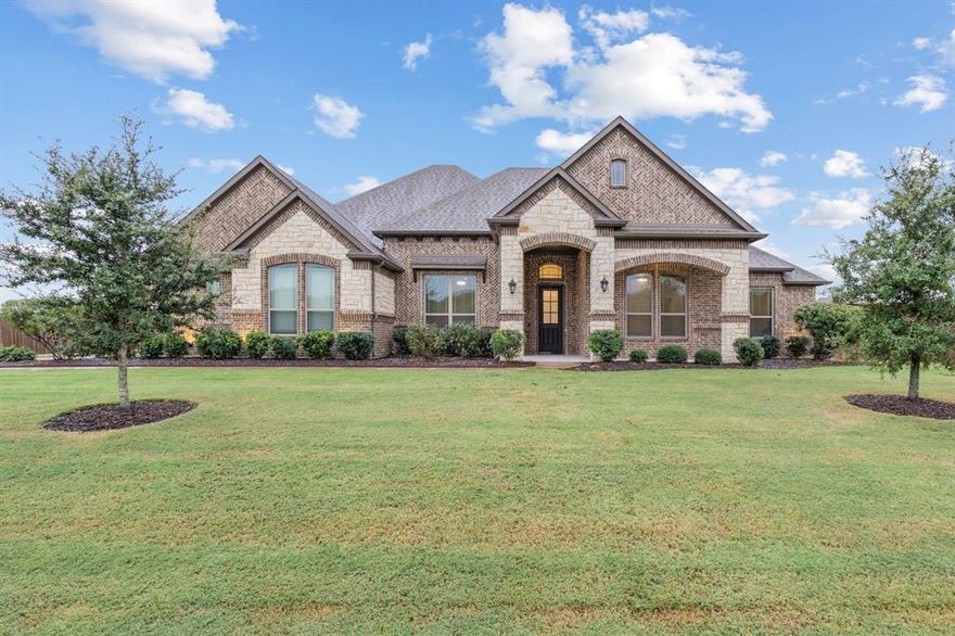 Welcome home to this stunning 2020 custom-built property that perfectly blends modern design with peaceful country living. Nestled on just over an acre and located in the county, you’ll enjoy no city taxes while still being only minutes from shopping, dining, and everything Waxahachie has to offer. Step inside to discover a thoughtfully designed layout featuring four spacious bedrooms, two and a half baths, and a versatile study or media room. The open concept living area flows seamlessly into a beautiful kitchen with granite countertops, a large island, and an walk in pantry that is ideal for both entertaining and everyday living. The private primary suite provides a relaxing retreat complete with a soaking tub, separate shower, and generous walk-in closet. Outside, enjoy a long driveway leading to a three-car garage with plenty of room for parking and storage. The expansive backyard includes a playground that will remain with the home, perfect for families ready to make lasting memories. This property offers the rare combination of custom craftsmanship, space, privacy, and convenience all in one beautiful home.