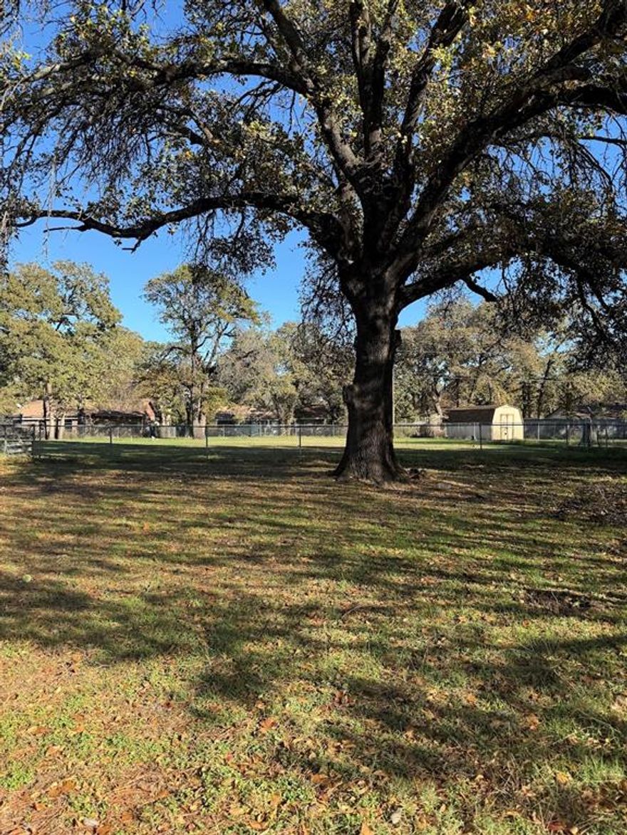Vacant cleared lot with some trees and partially fenced. Perfect for you to build on, please check with City of Azle for house size and restrictions.
No mobile homes or tiny homes allowed.