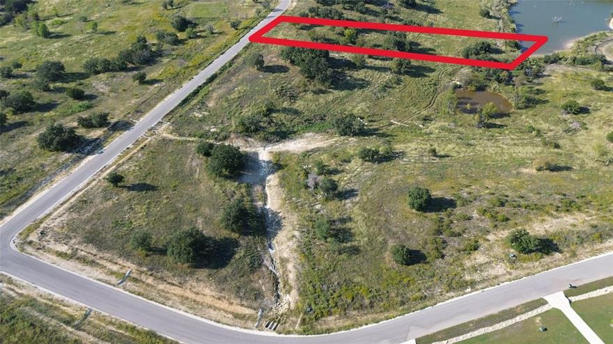 Welcome to Luker Ranch! Luker Ranch is located on the outside of Granbury and right off Lake Granbury, close to all the amenities your heart desires and the seclusion of being nestled in the country. Luker Ranch is only a short drive from Glen Rose Hwy and only 10 miles from shopping, dining, and everything Granbury has to offer. 717 R C Luker Court is a beautiful 2.719-acre residential lot located in the beautiful Luker Ranch subdivision. The lot is wide open, with a sloped landscape going down to a private community pond, offering the perfect setting for creating your dream home, with plenty of room for outdoor living, recreation, and breathtaking views of Lake Granbury. Enjoy the tranquility and charm of this sought-after area, where you can build a custom home tailored to your vision while being part of a friendly and welcoming community. Give us a call to find out more about 717 R C Luker Court and other lots available at the beautiful Luker Ranch!