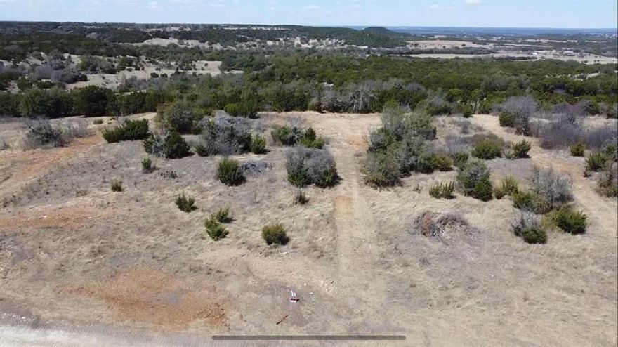 This 2.26-acre parcel of prime land offers an incredible opportunity to build your dream home on top of a mountain with breathtaking, panoramic views. Nestled within a gated community, this lot provides both privacy and security, while being just minutes away from the vibrant downtown of Glen Rose. Imagine waking up each morning to stunning vistas, enjoying peaceful surroundings, and having convenient access to shops, restaurants, and attractions the area has to offer. Whether you're looking for a tranquil retreat or a place to entertain, this is the perfect location to create your own mountain oasis.