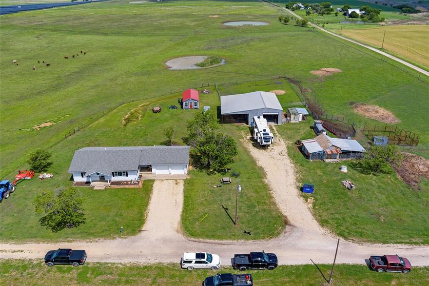 Country Roads Take Me Home !The opportunity for your very own Little House on the Prairie, complete with Farm and Ranch setup, has arrived! Also great for commercial use.A rare find! This 22.673 acre fenced Farm and Ranch includes a cozy and quaint Prairie Style Farm Home featuring cabinet space galore, eat in kitchen and formal living area which offers multiple options for living, dining, office, or playroom. Just off the garage you will also find a large laundry room with shower, perfect after a rewarding day working your cattle or crops.  Step outside and enjoy a glass of lemonade under the pecan tree as you soak in the clean country air and wide open spaces or enjoy the stars on the wide-open Prairie during the serene evenings. Your new Home comes complete with Rustic Vintage Barn with stalls and tack room as well as an additional 1,500 square foot metal building with a 50 x 25 open covered section for carport, RV,or patio. This solid metal structure on slab foundation building includes electricity, both 50- and 30-amp RV hookups and is also plumbed for water. Two rollup 12 x 12 doors give easy access for boat or camper storage, cars or workshop. Fantastic Barndominium potential opportunity awaits creative buyers with a Texas vision.
Shoulda been a Cowboy? Here is your chance as this amazing property comes complete with pasture, stock pond, livestock stalls, working pens, Pearson Original Cattle Chutes , hay ring and troughs. Farming more of your style? Chicken coops in place and plenty of Texas countryside for your garden and crops! Additional 10.7 Acres available which adjoins property, see MLS 120918846.
Don't miss this once in a lifetime opportunity located in the highly rated Penelope School District .