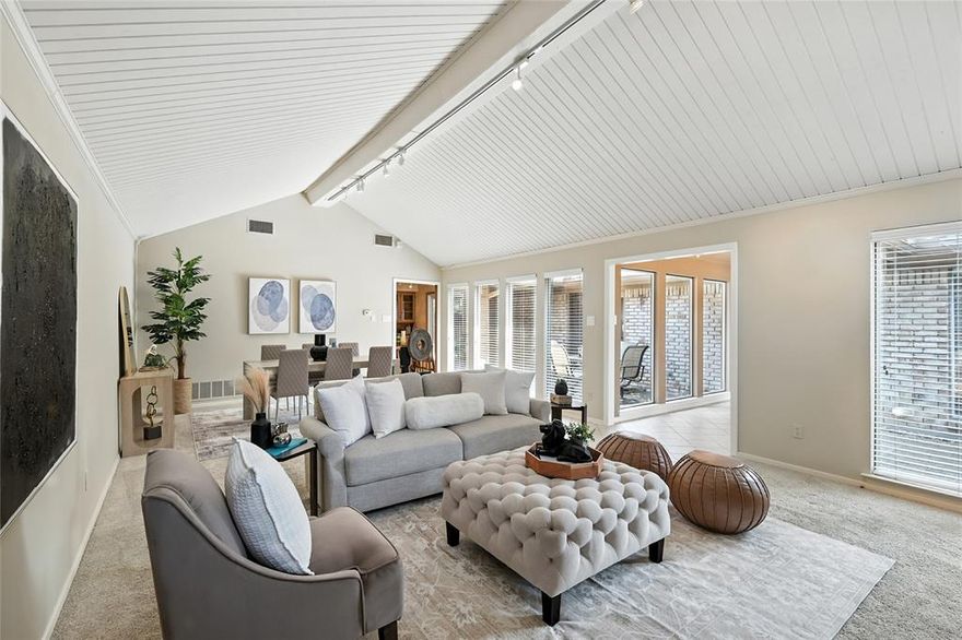 Discover this energy-efficient, soft contemporary home nestled in a well-established and sought-after North Dallas neighborhood offering both comfort and convenience with no HOA, zoning to top-rated Brentfield Elementary in RISD and FULLY PAID-OFF solar panels with low electric bills averaging $39 to $44 per month. Step inside to an inviting space filled with abundant natural light from expansive windows. The main living and dining areas feature vaulted ceilings, built-in cabinetry, and a cozy gas-log fireplace—perfect for relaxing evenings. The eat-in kitchen is equipped with granite counter tops and stainless steel appliances, all overlooking a charming private courtyard -- ideal for morning coffee or quiet outdoor dining. A spacious second living area boasts high ceilings, built-in shelving, and a desk, making it a perfect home office or flex space. The primary suite is a true retreat, featuring French doors that open to the courtyard. The primary bath includes dual sinks, a garden tub, a separate shower, and two walk-in closets. Secondary bedrooms are thoughtfully separated from the primary suite and offer ceiling fans and walk-in closets, providing comfort and privacy for family or guests. Enjoy outdoor living in the large backyard, perfect for entertaining. This home is designed for efficiency and savings. In addition to the solar panels, the home features extra attic insulation and Mylar window inserts. Additional highlights include a foundation repair with a transferable warranty. Ideally located with easy access to George Bush Turnpike and Dallas North Tollway, BaylorScott & White Hospital, and just minutes from Addison and the Galleria for premier shopping, dining, entertainment, and most importantly, the Wagging Tail Dog Park, for the 4-legged children in your life. Refrigerator and stackable washer and dryer to remain.