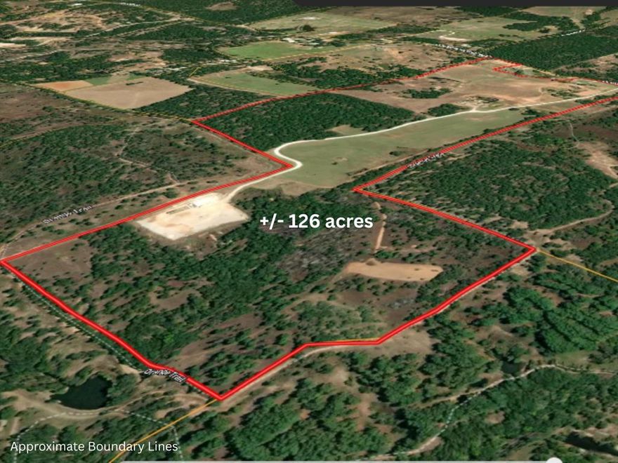 RARE OPPORTUNITY to own a legacy ranch bordering the Lyndon B. Johnson National Grasslands, where horses, cattle, and wide-open Texas skies create a lifestyle impossible to imagine! This AG exempt blend of open coastal pasture ideal for hay production, and natural terrain provides versatility for ranching, livestock, or recreational use. With the National Grasslands bordering the property, outdoor enthusiasts will appreciate direct access to opportunities for horseback riding, hiking, camping, wildlife watching, and exploring the great outdoors. The expansive setting offers incredible privacy while still being conveniently located near town. Offered for sale for the first time in over 100 years, this remarkable plus minus 126acre ranch presents a rare opportunity to own a legacy property where the seller is willing to convey all mineral rights owned with an acceptable offer. Located just NW of the Dallas Fort Worth Metroplex. The land features a variety of terrain with beautiful stands of pine, cedar, and mature oak trees on mostly fine sandy loam, creating a scenic and private setting. Two productive coastal pastures provide hay production, typically yielding two cuts per season. Last year one cut yielded about 52 bales averaging approximately 1,100 lbs. each. Water resources include two tanks, a natural spring, and a watershed. The property is fully fenced and well maintained, with firebreaks along portions of the perimeter. BONUS, the property includes a 1683 SF brick home with about 1.5 acres fenced with an open arena, 4 stall loafing shed, and cattle pens!  Direct access to County Road 2690. Bordering three sides of the is the expansive LBJ National Grasslands, nearly 20,000 acres of federally managed recreation area. Don’t miss your chance to own one of the greatest pieces of Texas. Whether you’re looking for a working ranch, weekend retreat, recreational paradise, or future homesite, this property captures the true spirit of North Texas country living.