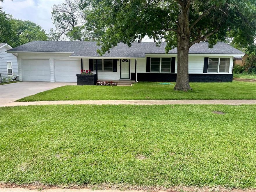 This charming 3 bedroom, 2 bathroom home has been completely remodeled inside and out. Enjoy the hardwood floors throughout the home and the newly updated kitchen and bathrooms. The new landscaping with full sprinkler system has been done in the yard and flower beds, with new grass in the front and it looks amazing! With the great location, this house is the perfect place to call home!