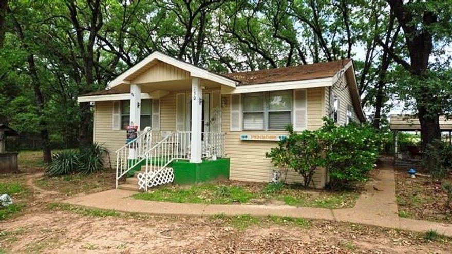 Charming 2 bedroom, 1 bathroom, vinyl sided home on 4 lots. Located close to shopping, medical, and has lake access in the subdivision. Offers hardwood and laminate flooring, enclosed back porch. Home has been well maintained. Detached garage and small storage building. All fenced. 4 person hot tube stays.