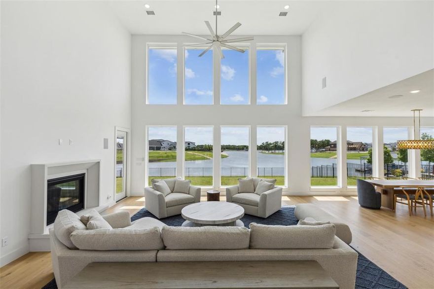 Unmatched Lakefront Views & Exclusive Contemporary Luxury
Experience a remarkable lifestyle just one hour from Dallas and 30 minutes from downtown Fort Worth. This exquisite contemporary estate, located in the prestigious, gated & guarded community of The Resort, offers direct lake access, world-class amenities, and a private golf course, all with breathtaking water views. This custom-built home is in pristine condition. Spanning 4,650 square feet, it features five bedrooms and five and a half bathrooms, all designed for effortless one-story living. The main floor includes a luxurious primary suite, two additional bedrooms, three bathrooms, and expansive living areas, while a versatile home gym can serve as a sixth bedroom.The upper level offers guest accommodations with two bedrooms, a Jack-and-Jill bath, and a spacious game room.This immaculate estate provides stunning waterfront views and front-row access to the beauty of Eagle Mountain Lake. This property is a true sanctuary where luxury and nature converge, making it an exceptional place to call home