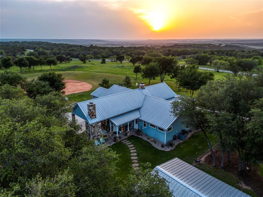 Unparalleled Ranch Life is here! This 20-acre ranch has the most charming craftsman style farm home in Texas. The residence includes 4 beds, 3 baths, and a versatile office space. Each room offers stunning views, especially from the kitchen, where a vast island, ample cabinets, and extensive counter space make cooking a pleasure. High-end appliances include a gas cooktop and double oven, while unique antique fixtures, barn wood interiors, a double drainboard sink, and an extremely rare L. Wolff American Standard clawfoot tub adds untouched character. Outdoors, experience the pool life, perfect for summer days. The property hosts a large show barn, equipped with electrical wiring, a controlled mister system, and plumbing. Other amenities include cross-fencing, landscape lighting, a lush sodded yard, and a regulation softball field with a 75-foot batting cage. Don't need a softball field? It's the perfect spot for an arena or a shop! Live amidst the neighboring high fenced land filled with exotic animals. A true craftsman masterpiece where elegance meets functionality.