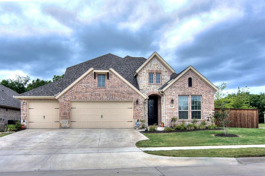 Relax on your gorgeous backyard covered patio in a quiet, serene setting looking onto acres of woods & trees behind you. Home is less than 7 years old and updated to the max: Wood Floors, Granite Countertops, Tile Backsplash, SS Appliances, Gas Cooktop, beautiful Stone FP (incl gas logs). Master bath downstairs w- Granite & Ceramic Tile shower, large Walk-in closet & overlooks back yard w- view of woods. Unique floor plan is VERY Open. All bedrooms down except 1 upstairs! Formal living room, family room and a 3rd living area upstairs can be study, playroom, exercise room, etc) Game room or study area between bedrooms 2&3 downstairs. Upstairs: Game room and Media or bedroom. Incls: Community pool,splash pad,jogging paths & greenbelts. Also, a huge park within walking distance.  Owner is willing to do a lease that is less than 6 months.