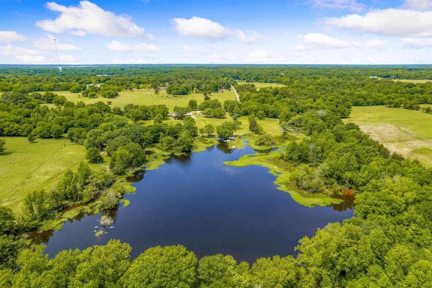 Located just 2 hours East of Dallas, this 241 acre ranch features a completely remodeled 3 bedroom ranch house, fully stocked 10 acre pond with large gazebo and upper deck, equipment shed, aviary and boundless possible uses! Native pasture land offers excellent haying opportunities, livestock grazing, and peaceful seclusion. As a recreational hunting & fishing ranch, you’re likely to see deer, boar, bass, catfish and more. You'll find 2 insulated Ranch King blinds, one 8ft x 8ft and one 8ft x 6ft on the property. Plus 40ft x 60ft equipment shed, 20ft x 20ft aviary for birds and barn all with electric & water. Retreat to the charming 2600 sq ft house with high end appliances including Sub Zero fridge, Wolf oven, Bosch dishwasher, wine cooler, granite countertops with custom cabinets, huge kitchen island and gorgeous wood flooring. Enjoy breathtaking views of nature and endless recreation.
Nearby access to electricity & water can be found on the Northern and Southern portions if needed.