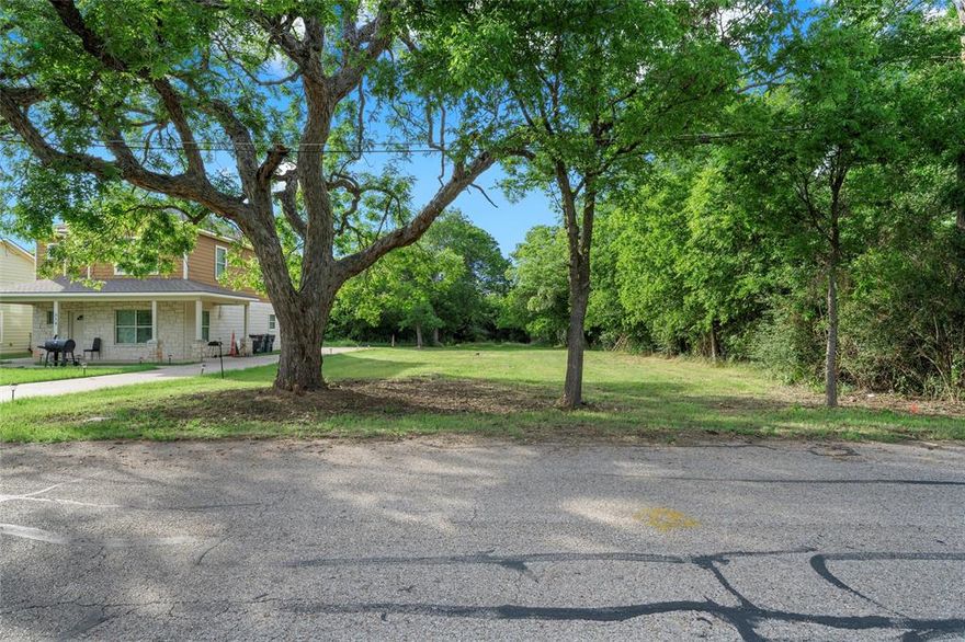 Rare opportunity to own a prime piece of land near Baylor University! Perfectly situated just 1.5 miles from campus in a rapidly growing area, this cleared and level over half-acre lot is ready for your vision—whether that’s a custom home, student housing, or a smart investment property. Nestled in a peaceful, country-like neighborhood, the lot sits directly across from a scenic city park and near established family estates as well as a growing cluster of vibrant student housing along French Avenue and South 4th Street. Cleared of underbrush to showcase its majestic 100+ year-old pecan trees, the property is equipped with city water and sewer connections—ready for immediate development. With 60 feet of road frontage and a 450-foot depth, it offers ample space and flexibility for a variety of build-out options. The land gently slopes toward a creek at the rear, while the front portion lies entirely outside the floodplain. Picture future residents enjoying quiet evenings on the front porch as students take evening strolls, neighbors ride horseback, and kids play in the nearby park—all just minutes from Baylor University and downtown Waco. Don’t miss the chance to create something special in one of Waco’s most promising areas—300 French Avenue awaits your vision!