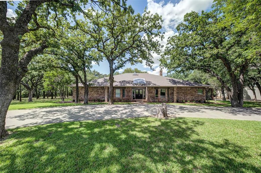 THIS ONE-OF-A-KIND PROPERTY IS NOT ONE TO MISS! This traditional- Mid Century Modern, 4,414 sq ft home sitting on 49.84 acres of land will give you your dream home already set to move into. The home is 4 bedrooms and 3.5 baths. Along with the large main home comes a 1,024 sq ft pool and guest house with hot tub. It also includes a kitchen, changing rooms, bath and shower as well as an outdoor grilling area. The large swimming pool also has a hot tub included in it. You will also have your own full-sized basketball, tennis court and many other features. A large, 1,440 sq ft metal shop with a 960 sq ft covered shed also adds to this incredible property. There are two water wells as well. One is for the water the house and improvements and the other is for the storage tank and sprinkler system. There are too many extras to mention here. Beautiful oaks trees certainly add to the charm of this amazing property. While this property is listed to sell as a whole with the 49.84 acres, the seller will consider selling the house and improvements with a 9.86 acres tract separately if so desired. THE ASKING PRICE FOR THE HOUSE AND 9.86 ACRES IS $1,344,460.00. THIS GREAT PLACE HAS TO BE SEEN TO BE FULLY APPRECIATED!! FOR MORE PHOTOS AND AERIALS SEE THE VIRTUAL TOUR LINK!!