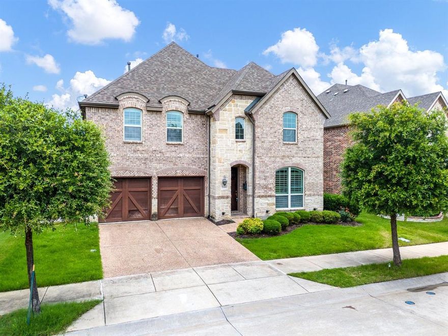 STUNNING 5-BEDROOM HOME IN DESIRABLE CASTLE HILLS! Welcome to this beautifully maintained home in the heart of Castle Hills, offering 5 spacious bedrooms and 4 full baths. Designed with comfort and functionality in mind, this home features two bedrooms downstairs, ideal for guests or multi-generational living. Gorgeous hardwood floors flow throughout the main living areas, creating a warm and inviting atmosphere. The open-concept layout includes a chef's kitchen overlooking a spacious family room filled with natural light-perfect for entertaining or relaxing with loved ones. Upstairs, enjoy movie nights in the dedicated media room, offering a true cinematic experience at home. Nestled just minutes from GRANDSCAPE,, one of the largest and most dynamic mixed-use developments in the country, you'll enjoy easy access to world-class shopping, dining, entertainment and attractions like Nebraska Furniture Mart, Scheels and the Galaxy Theaters. Located in a master-planned community with exceptional amenities, parks and walking trails, this home combines luxury, convenience, and lifestyle.  Don't miss your chance to own in one of North Texas' most sought after communities! Open House June 14 & 15 from 1-3.