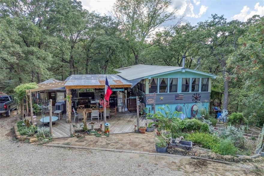 Charming 2 Bed, 2 Bath Home Near Lake Texoma
Just one mile from the Sherwood Shores boat dock, this property offers the perfect blend of lake life and country living. Situated on three spacious  parcels, compromising 10 lots in total, with additional lots on each side, you’ll enjoy privacy, room to expand, and a true resort-style setting.
Surrounded by mature trees and lush grass, the home feels like a peaceful retreat, miles away from the hustle and bustle of the city. Outdoor living is at its finest with a covered patio, outdoor kitchen, and outdoor shower, plus a private entrance at the back of the home for convenience after a day on the lake. It’s the perfect setup for family gatherings and entertaining friends. Both bedrooms are downstairs, and one full bath.  On the main floor you'll find the living rooms, dining area, kitchen and full bath. 
Inside, the home is full of eclectic charm, featuring hardwood floors throughout and a warm, inviting atmosphere that makes every room feel special.
Whether you’re looking for a full-time residence, a weekend getaway, or a lake retreat, this property delivers the lifestyle you’ve been dreaming of.
Professional photos are pending.

ALL information herein is deemed reliable but not guaranteed.  Buyer and buyer's Realtor should verify room measurements, taxes, school information and all other details relevant to the Buyer.