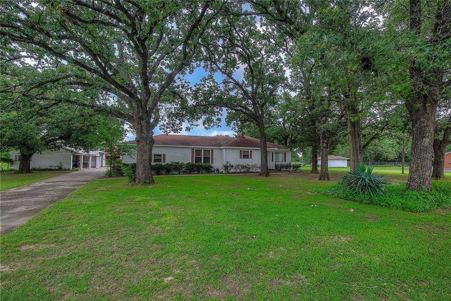 * SIGNIFICANT PRICE IMPROVEMENT *This country home in the city limits of Greenville is ideally located in a grove of massive oak trees on a splendid 2.38 acre equestrian property.  The home has been unoccupied for many years and is in need of extensive repairs and updating while still offering a setting second to none.  The home offers 2 living areas, an eat-in kitchen and dining with 2 bedrooms and a central bath.  The home is part of a residential site that could be the grandest of homesites if you choose to start over with your own new home.  The property offers a horse or cattle barn with 8 stalls and tack room, concrete floored center aisle and fenced corral areas.  The north part of the land is open pasture and the entire property is fenced and cross fenced with pipe, rod and wire fencing.  A stock pond is on the ground and the possibilities for this property are endless. Suitable for development.  Live in the city with that country feel.  This property will not disappoint.