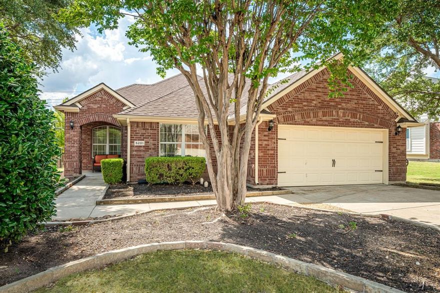 Welcome to 5201 Lake Bend Drive – where comfort meets timeless style in the heart of McKinney! Nestled in a beautifully maintained neighborhood, this inviting home blends everyday functionality with thoughtful charm. As you walk up to the welcoming covered front porch, you can immediately feel the warmth & character that make this updated home so special. Step inside to an open, light-filled layout adorned with pretty neutral décor, ceramic wood-look tile, and warm wood flooring that flow beautifully throughout the living spaces - no carpet in this home. The spacious living area connects seamlessly to the kitchen and dining areas, creating a natural gathering place for friends and family. The kitchen is both stylish and functional, featuring lovely granite counter tops & backsplash, stainless steel appliances, a large island, breakfast bar with bar stool seating area, & glass-insert cabinets that add a touch of elegance. With generous counter space and a bright, open feel, it’s the perfect place to cook, entertain, or simply enjoy your morning coffee. A dedicated study with handsome French doors offers a quiet, versatile space for work or relaxation. The primary suite, located split from other areas, serves as a peaceful retreat with a spa-like ensuite bath and ample closet space (very cute so take a peak), while the additional bedrooms are split from the other areas, roomy and adaptable for family, guests, or creative use. Outdoors, the backyard offers a comfortable setting under the covered & extended patio ideal for gatherings, play, or unwinding at the end of the day. Located near top-rated schools, parks, and McKinney’s vibrant shopping and dining destinations, this home captures the best of suburban living with personality.