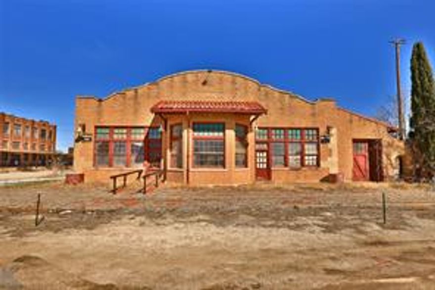 The Burlington depot at the corner of Locust & S 2nd is the gateway to this 5.42 acre parcel of largely undeveloped land in Abilene's SoDA district. Zoned LI, in an opportunity zone, & used for rail, this tract is the largest, contiguous acreage in the South Abilene Planning District. Two buildings are on this property: the 3040 sf Burlington depot & the 3200 sf rail maintenance barn. With the arrival of new bars & restaurants in this area, this parcel would be suitable for redevelopment with mixed-use housing and retail to compliment extant businesses. A 1.08 acre property in the center of this parcel with a 15,000 sf warehouse at 133 Cherry is also listed, bringing this tract to 6.5 acres in downtown Abilene.