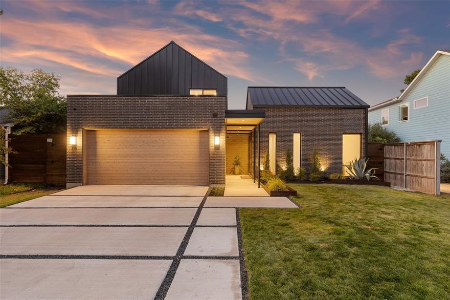 Immerse yourself in the epitome of classic modern architecture with this distinctive Midway Hollow home. White oak flooring, custom lighting & large commercial-grade windows accentuate the open floor plan, creating an ambiance of modern sophistication. Designed by renowned architect Douglas Hildinger, this innovative dream home features a standing seam metal roof, luxurious pool & unparalleled attention to detail. Impressive main living area features a cast stone-surrounded fireplace. The kitchen is a culinary haven with JenAir commercial-grade appliances, custom millwork adorned in Brazilian wood veneer, floating shelves, quartz counters, & an expansive island. The first level primary suite overlooks the pool & features a spa-like bath & his and hers closets. Another full bed + bath downstairs also. Upstairs are three bdrms each with ensuite bths, walk-in closets & a lovely living space. State-of-the-art smart features, pre-wired for complete automation & zoned speakers throughout.