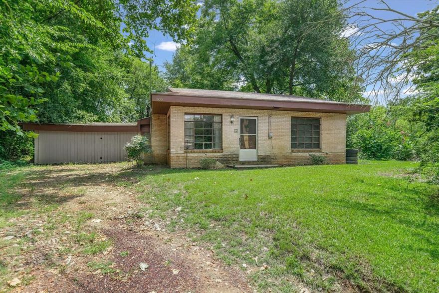 Located on a quiet, well-established street in Grand Saline, This country home sits on 1.1 acres and offers the perfect blend of privacy, space, and opportunity—whether you’re looking to settle into a quiet lifestyle or seeking a property with renovation potential. The home sits back from the road, framed by mature trees and wide-open skies, giving you the tranquility of country living. It's a perfect opportunity for investors looking to expand their portfolio or for buyers seeking a future personal residence. Close to town, schools, and restuarants. Being sold AS-IS, don't miss this rare property, it is ready for your vision.