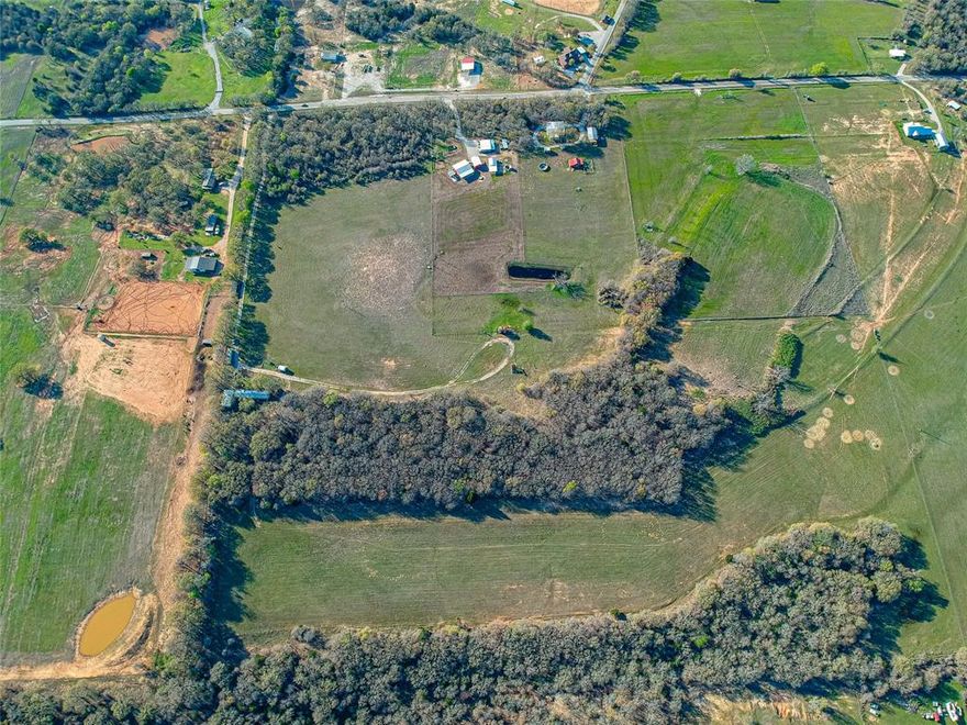 This lot of land includes 16 acres of dense areas adorned by mature trees and sprawling grazing pastures. Property
meets requirements for agriculture exemption. Electricity and well water are available on property, ensuring modern
comfort to build your dream home in a serene setting. Create your dream lifestyle surrounded by nature's beauty, while
maintaining easy access to city amenities and urban opportunities. This rural gem is nestled just 15 minutes from
Decatur and a mere 50-minute commute to Fort Worth. Barndominiums welcomed!