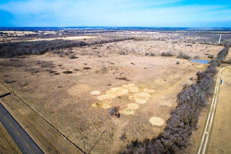 This 50-acre property is located just south of Aquilla, TX, with paved frontage along FM 1304. The land features gentle rolling topography and two stock tanks, supporting both livestock use and wildlife habitat. Deer and waterfowl are known to frequent the tanks, adding recreational appeal. The property is fully fenced and well-suited for cattle or a country homesite. The seller is currently working with TxDOT to establish a private entrance from FM 1304. Seller is a licensed Texas attorney. Seller’s spouse is a licensed Texas real estate agent.