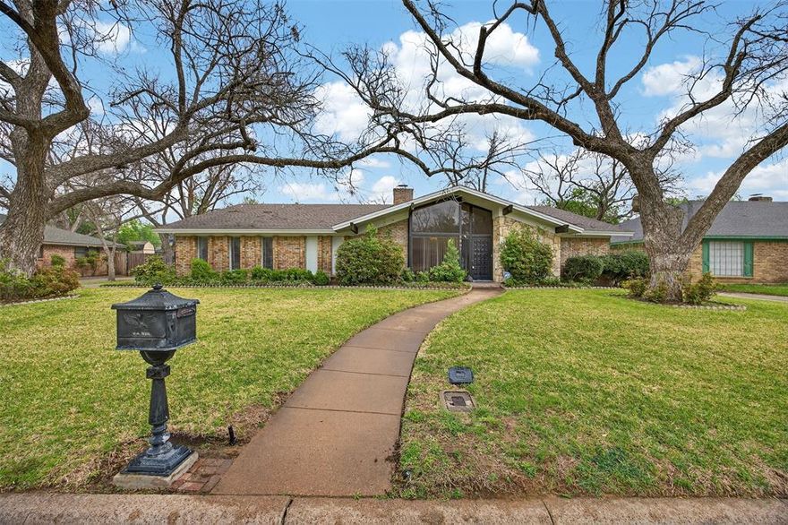 MID-CENTURY MODERN in SCOTS WOOD ARLINGTON WITH TERRAZZO FLOORS, TWO PRIMARY SUITES, SEE-THROUGH FIREPLACE AND REAR ENTRY GARAGE! Located in one of Arlington’s most sought-after neighborhoods where homes rarely come on the market, this architecturally rich home is a dream for lovers of true mid-century design. Upon entry, you’re greeted by iconic terrazzo tile flooring with embedded stone detail, setting the tone for the character throughout. The flexible layout features two living areas, two dining spaces, and a split-bedroom floorplan with a true mother-in-law suite or dual primary bedroom setup. The formal living area showcases a striking see-through fireplace that connects to the oversized family room, creating a spacious yet defined entertaining area. A stunning terrazzo step leads to sliding glass doors, bringing in natural light and enhancing that classic indoor-outdoor mid-century feel. Both bathrooms feature beautifully preserved original tile that is already shining and ready for its next owner. Enjoy a lush backyard garden with mature trees, plus a rear-entry garage with an electric wrought iron gate for added privacy. If you’ve been waiting for a true mid-century modern home in Arlington with character, flexibility, and location, this is the one. Priced to allow buyers to make it their own while preserving its timeless design.