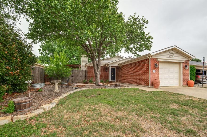 Adorable! This cute home has been well maintained and ready for new owners. Located in the Marine Creek Hills neighborhood. Two nice sized bedrooms. Primary has large bathroom and walk in closet. Nice living area with natural light and cozy wood burning fireplace. Enjoy the backyard with great sitting area for fun cook outs and entertaining. New windows were installed in 2025. Water softener system.  Close to shopping and restaurants.