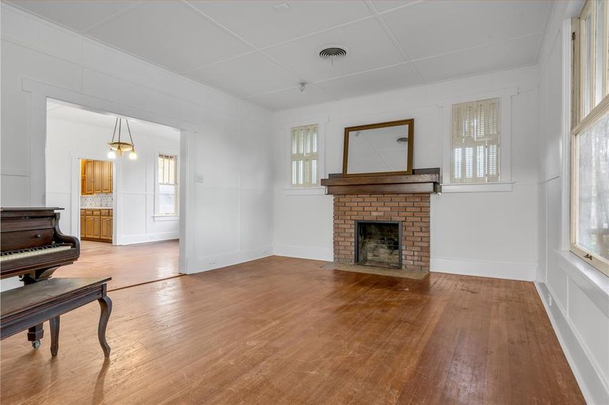 INVESTOR SPECIAL! Welcome to this stunning early 1900's property in the heart of Arlingtons Original Town Neighborhood. Historic Dickerson Home was built by Martin Luther Dickerson, a cotton broker, in Arlington and Ft. Worth in 1917. The home has stayed in the family until now! Walking distance from Downtown Arlington and minutes from the stadiums - you can not beat this location! This home sits on 3 lots totaling over a quarter of an acre! The records show a 3 bed 1 bath home that is 1800 sqft, however the home was updated in the 70s making it a 3-4 bedroom house (one bedroom does not have a dedicated closet and is labeled as an office) and 2.5 bath with a full and half bathroom downstairs and a full bathroom upstairs. This home is within 1 mile of the stadiums and is therefore zoned for Air BnB in the city of Arlington. Home is sold AS-IS. ***Home has recently undergone pest control and a full interior painting*** MULTIPLE OFFERS - HIGHEST AND BEST DUE 12.7.23 5pm