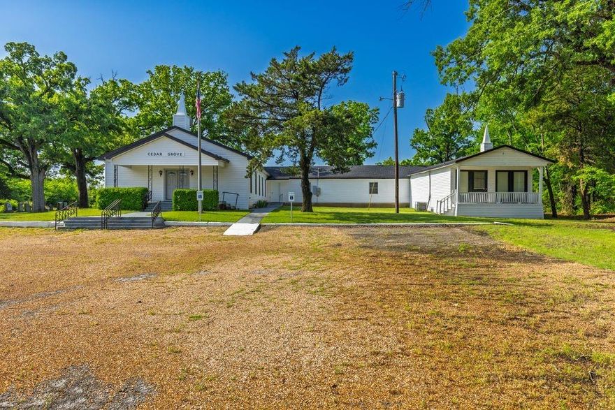 Historic Cedar Grove Church – Ready for Your Vision
Discover the charm and potential of Cedar Grove Church, a beautifully maintained property with roots dating back to 1898. Situated on a serene 2 plus acre setting adorned with majestic oak trees, this property offers endless possibilities for a congregation, wedding venue, private school, or retreat center—just minutes from I-30 and less than an hour from Dallas.
Main Sanctuary Building – Approx. 5,572 Sq Ft
This spacious building features:
• A large sanctuary perfect for worship or events
• Five versatile classrooms
• Separate foyer and fully pre-wired media room
• Pastor’s office
• Recently upgraded aerobic septic system
• Newer roof for added peace of mind
Fellowship Hall – Approx. 1,500 Sq Ft
• New appliances
• Tables and chairs included
• One-year-old roof
• Mounted 55-inch TV
• Upgraded electrical system
• New fire extinguishers
Additional Features:
• On-site cemetery with historic significance
• Large concrete pad (approx. 31x70) ideal for outdoor weddings or events
• 20x20 storage building with additional space
• Outdoor LED lighting for evening events
• Beautiful, quiet country setting with easy access to city conveniences
• Recent property survey completed
Whether you’re looking to grow a ministry, host unforgettable events, or establish a peaceful retreat, Cedar Grove is a rare opportunity with both character and modern updates.

Schedule your private showing today!