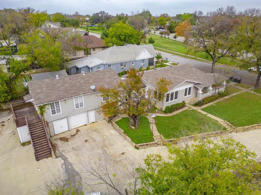 Discover a rare opportunity in Fort Worth’s North Side — a beautifully updated 1920s Craftsman duplex just 2 miles from downtown! This unique multifamily property offers 2 fully independent units across 2,789 sq ft on a spacious 0.303-acre lot. The front unit (4 bed, 2 bath) was tastefully renovated within the last 5 years and showcases double-pane windows, LVP flooring, real wood floors in the primary bedroom, granite countertops, stainless steel appliances, white cabinets, updated bathrooms, and a welcoming front porch. Extras include a mudroom, stackable laundry, ceiling fans, and faux wood blinds. One bedroom features an exterior entrance, offering flexible use as a home office or bonus income space.

The rear unit (3 bed, 2 bath), perched above the garage, features a private deck, white appliances, large in-unit laundry room, and ceiling fans throughout. Parking is plentiful with side access and rear spaces available. Zoned for multifamily use, this versatile property is ideal for an owner-occupant looking to live in one unit and lease the other for supplemental income or to start your investing empire!

Located right off Hwy 199 & University, this home is close to parks, restaurants, and all the culture of downtown Fort Worth. A true investment gem with charm, income potential, and unbeatable location!