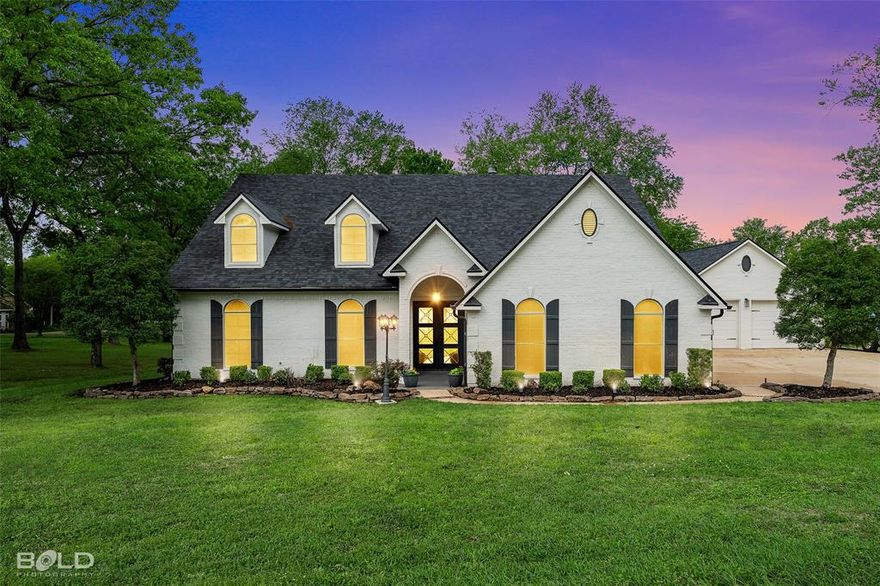 LAKEFRONT LIVING AT IT'S BEST ON BEAUTIFUL CYPRESS LAKE IN BENTON!  Nestled in a serene, quiet neighborhood, this newly remodeled LAKEFRONT home offers a perfect blend of luxury, comfort, and outdoor living. With over 4,000  are feet of beautifully designed space, this six-bedroom, four-bathroom gem is ideal for both relaxation and entertainment.

Step inside to discover expansive living areas, including multiple spacious living rooms that offer plenty of room for family and guests. Enjoy movie nights in your private home theater or challenge friends and family to a fun-filled evening in the game room. Every corner of this home exudes a sense of warmth and style, with modern finishes and thoughtful design.

The gourmet kitchen seamlessly flows into the open-concept living and dining areas, providing an inviting atmosphere for gatherings. Each of the six bedrooms is generously sized, with the master suite featuring sweeping lake views and a luxurious en-suite bathroom.

Outdoor enthusiasts will fall in love with the expansive deck, which features a relaxing jacuzzi and stunning views of Cypress Lake. Whether you're enjoying a peaceful evening or hosting a summer gathering, this outdoor space is perfect for any occasion. The private boat dock can accommodate a large wakeboard boat and two jet skis, providing direct access to the water for endless fun on the lake. Separate 2-car garage features full bath.