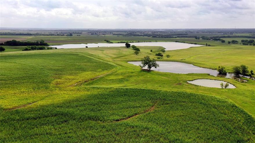 Looking for room to relax just outside Hillsboro and minutes from I-35? This 200+ acre ranch gives you space, water, and real Texas views. The 25-acre lake is the centerpiece—great for fishing, quiet mornings, launching a boat, or building your dream home overlooking the lake. There’s also a 1.5-acre pond, just right for an afternoon break or watering livestock.

Horse folks will appreciate the white pipe fencing around the dedicated turnout area, while the 60x40 barn is built for work and comfort with two 12’ drive through roll up doors, four horse stalls, two with their own turnout, and a spacious overhang for keeping equipment and trailers out of the weather. The barn even includes a one-bedroom, one-bath suite—perfect for a guest, family member, or ranch hand. The main home (1,814 square feet) features three bedrooms and two bathrooms, with plenty of windows to let in views of your pastures and water. Good roadways make it easy to move around the ranch, from the barn to the lake and everywhere in between.

About 65 acres are currently in cultivation (or easily converted to coastal), bringing in passive income each year. The rest of the property is set up for horses and cattle—just as it’s been for the last 20+ years in the family. If you want a property that’s ready for horses, cattle, fishing, and plenty of quiet evenings, come take a look. This place is ready to be a part of your next chapter just outside Hillsboro. Give us a call to set up a tour and see what makes this ranch special.