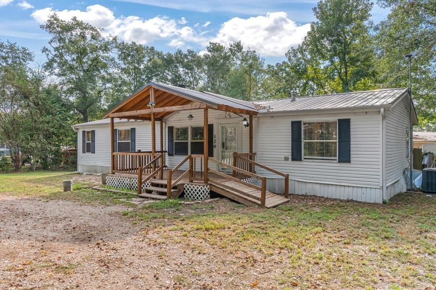 Welcome to this charming 3-bedroom, 2-bathroom home in the gated community of Hickory Hills. Along with its spacious bedrooms, the home offers a versatile bonus room that can serve as a 4th bedroom, private office, or flex space to fit your needs. The inviting living area features a cozy wood-burning fireplace, while the updated kitchen and beautifully renovated bathrooms bring both modern comfort and style. Designed for durability and relaxation, the home boasts a metal roof, a large covered front porch, and a spacious covered back porch. As an added bonus, it also includes a mosquito misting system so you can fully enjoy your outdoor living space and outdoor building for all of your storage needs. Life in Hickory Hills centers around Callender Lake, a 365-acre private lake perfect for boating, fishing, and swimming. Community amenities include a swimming pool, boat ramp, fishing pier, and a children’s park with basketball court and playground. There is also a swim beach with picnic area, two public bath houses, and a covered pavilion complete with a kitchen that can be reserved for family gatherings or large events. Whether you’re looking for a full-time residence or a weekend retreat, this home offers modern updates and timeless charm in a community designed for both relaxation and recreation.