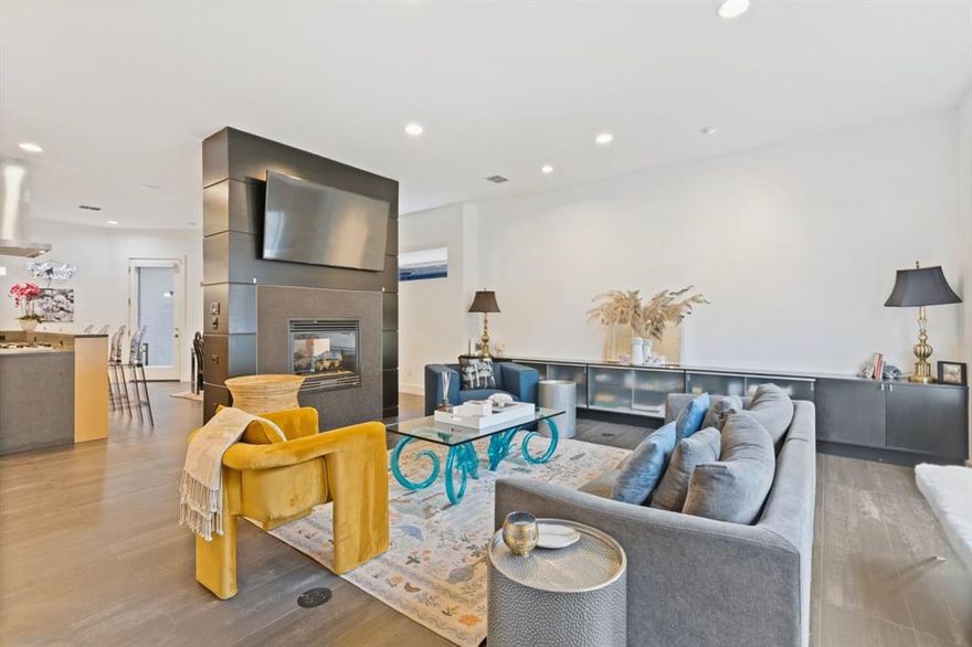 Pristine modern half-duplex on a quiet, tree-lined street that is tucked conveniently between Oak Lawn & West HP with Downtown views. This entertainer's dream offers an open floor plan with beautiful hardwoods, equipped with an elevator, pass through fireplaces, three gracious Living spaces, chef's kitchen complete with wine fridge, custom cabinetry, five burner gas stove and built-in fridge. Second level primary & guest en-suites with private balcony and are adjoined by a gracious living area and powder bath. Two custom walk-in closets, spacious bath with double vanities, steam shower and fireplace complete the generous primary bedroom. On the third floor you will find a flex space that can be used as a third bedroom, study, workout room or additional living area. Enjoy panoramic sunset views on the 700 sq ft rooftop terrace overlooking the Dallas skyline. Property can be leased furnished please see agent for more details.