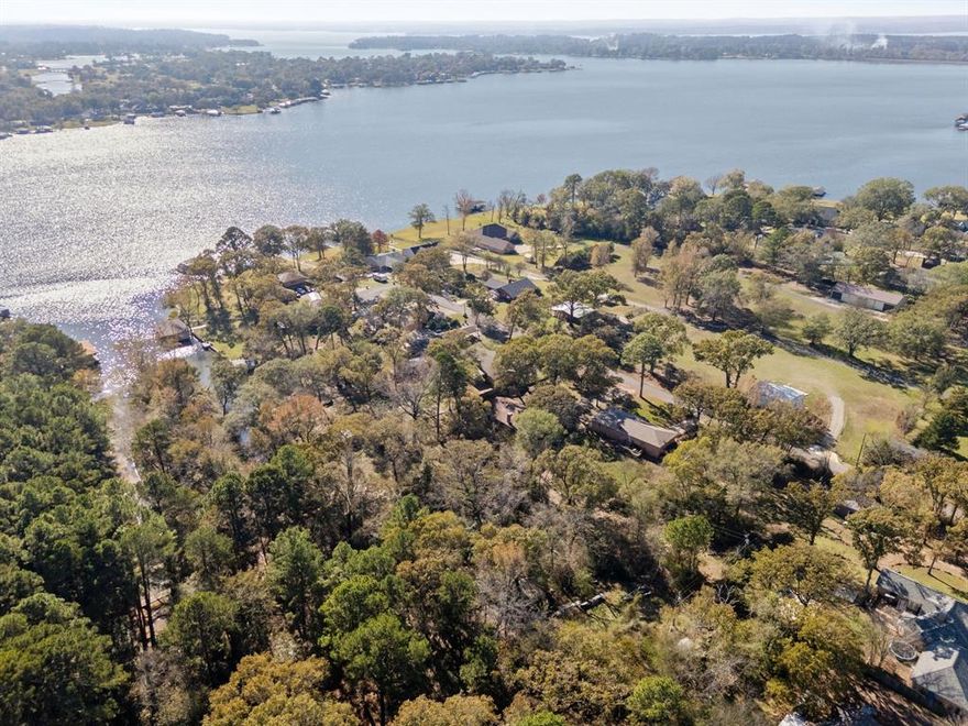Discover your next investment opportunity on Lake Palestine, ideally situated in the highly sought-after Bullard ISD. Tucked at the end of a quiet canal within a well-established and peaceful community, this property offers incredible potential. Whether you're planning a short-term rental or your next flip project. Built in 1985, the charming 2,200+ SF home features a spacious and functional layout, including three bedrooms, two and a half baths, and an open living and kitchen area ideal for entertaining. All it needs are the finishing touches to bring your vision to life. Enjoy direct access to the canal that leads straight into Lake Palestine, plus there is a shared private picnic area behind the canal - an inviting spot to unwind with picturesque views of the sunset over Lake Palestine or just to enjoy a good book. With no HOA, private lake access, and outstanding investment potential, this property is a rare find. *Please use caution when touring the home due to incomplete improvements.*