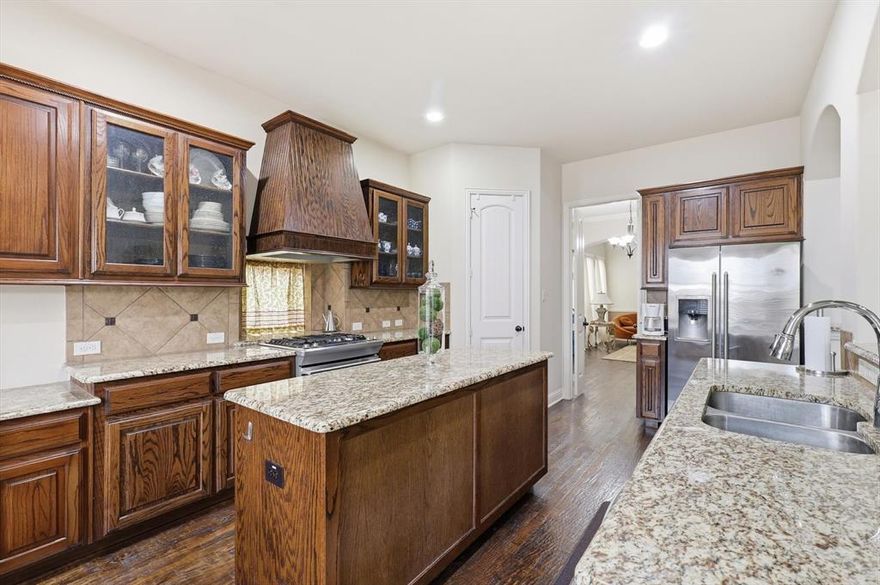 Location-Location! CLOSE to community pool area so FORGET the POOL MAINTENANCE and gym membership! Exceptional property blends luxurious finishes with refined comfort and thoughtful design. From the moment you enter 1113 Grant Avenue, you’ll notice the stunning handscraped hardwood flooring flowing throughout the entry, dining, kitchen, breakfast, study, and living areas—setting the tone for quality craftsmanship at every turn. The chef-inspired kitchen features elegant granite countertops, rich cabinetry, and an open layout perfect for entertaining. The impressive two-story fireplace anchors the spacious family room, where wood accents create warmth and character. With spacious formal living and dining rooms, this home delivers refined charm and effortless flow for both intimate dinners and lively get-togethers.
This home is loaded with premium energy-efficient features, including a 16 SEER AC, tankless water heater, radiant barrier, low-E windows, and superior insulation—providing comfort and savings year-round. Upstairs, you’ll find a game room and media room complete with a wet bar, ideal for movie nights or hosting friends. Three generously sized secondary bedrooms offer plenty of room for everyone. As an added bonus, three bar chairs the armoire, pool table and wine fridge will remain with the home! Step outside to a fantastic backyard with an extended covered patio, perfect for relaxing, grilling, or enjoying outdoor gatherings in any season. The 3-car garage provides both comfort and functionality. Lantana residents enjoy access to top-rated schools, scenic walking trails, resort-style pools, new pickleball courts, amenity centers, and more. Please note that HOA Dues will increase to $131 per month in 2026. Boasting refined finishes, energy-smart construction, and entertainment-ready spaces, 1113 Grant Avenue is a gorgeous home that has it all. Schedule your private showing today!