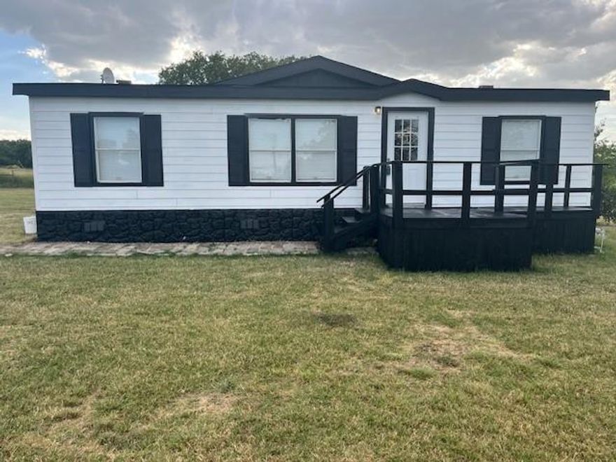 Bonus! Sign a 12 month lease and get the 7th month rent FREE!  
 Welcome home to this 3 bedroom 2 full bath manufactured home on close to an acre! This home has been completely painted inside and out. Beautiful floors! Lots of kitchen cabinets. Huge primary bath w jetted tub. This is a great place for you and your family to enjoy life in the country. Just outside of Krum, less than 10 miles to I35. This won't last long!  * Tenants + Tenants' agent is responsible for verifying all information, measurements, schools, fees, regulations.