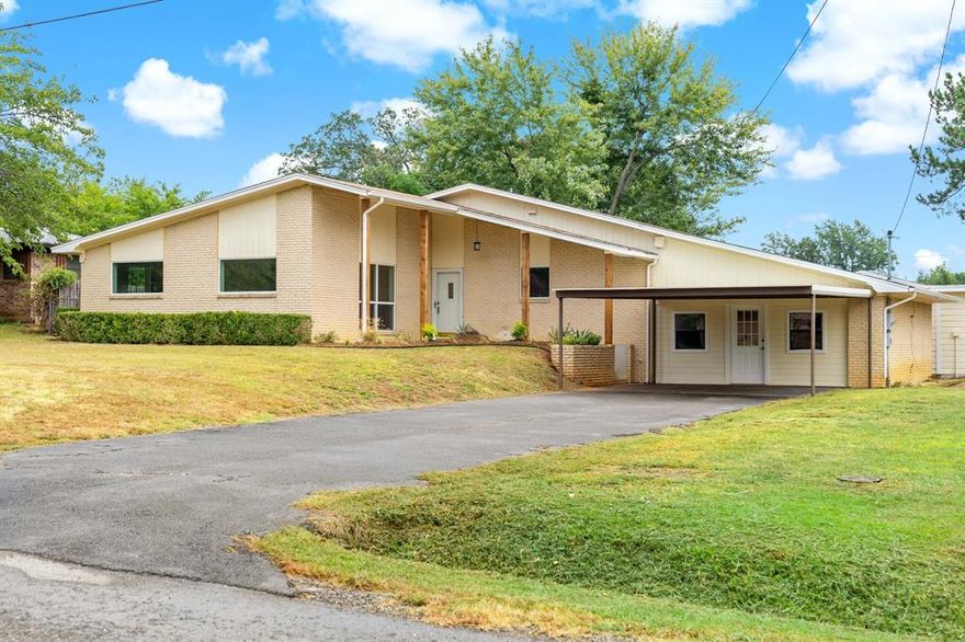 Spectacular home just on the edge of town. The moment you pull in the driveway you will appreciate the unique architecture, beautiful yard and new landscape. The backyard is spacious with mature trees for shade. The total lot size is almost one half acre and has a spacious storage building detached from the home. The home features 3 bedrooms, 2 baths, updates throughout. That includes completely updated kitchen with appliances, quartz countertops, tile backsplash, fixtures and appliances. New windows throughout and recent luxury vinal plank flooring, paint and fixtures. There is a bonus room with exterior door that would be perfect for home gym, office or cold be 4th bedroom. Enjoy morning coffee year around from the enclosed sunroom facing the back yard. Schedule your tour today.