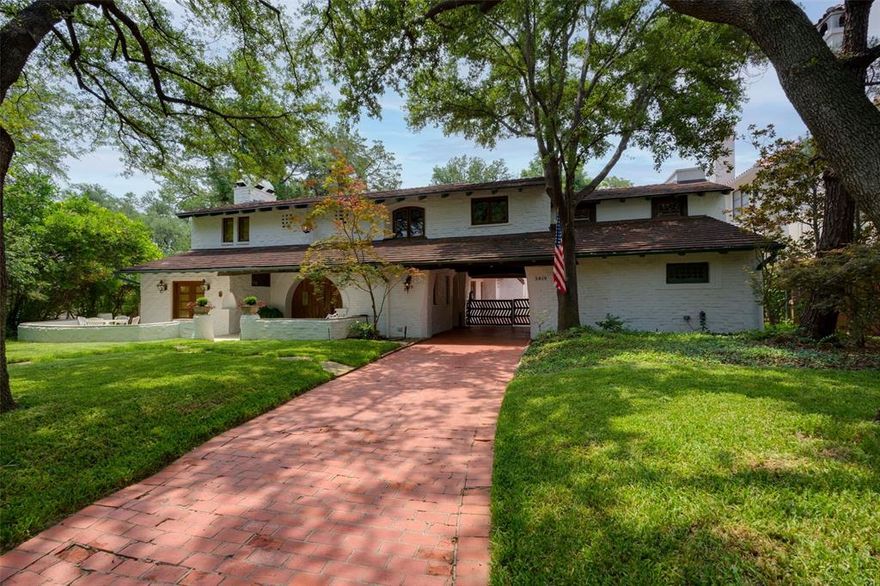 This is a crown jewel of University Park, a beloved icon —given landmark status by Preservation Park Cities & listed as one of Park Cities top 100 significant homes — that has transcended time. It’s a place for both grand and intimate living, a perfectly scaled home architecturally rewarding and completely unique. Like a country lodge, the large spaces, tall windows, flowing floor plan with private front patio and second floor veranda seamlessly blending the indoors with the outdoors. Dilbeck’s trademark touches are everywhere with rugged wood beams, brick floors, white-oak floors, gently arched passageways, iron light fixtures, pecky-cypress front door, a  porte-cochere with wooden gate, and more. Sensitively updated over the decades and lovingly maintained by current owners, it’s an escape from the world outside, a true Hacienda-style home with immense character and thoughtful living. A personal retreat that defines easy living, it demonstrates the art of Charles Dilbeck at his best.