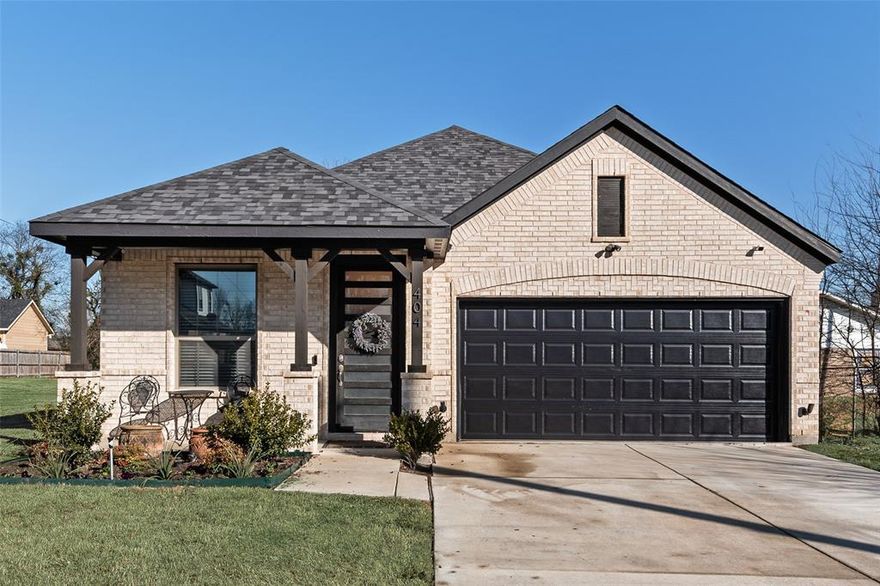 Welcome home to this stunning 4-bedroom, 2-bathroom gem nestled near downtown Terrell. This beautiful like new residence offers the perfect blend of modern elegance and small-town warmth. Enjoy mornings or evenings sitting on the covered front porch. Inside, you'll immediately notice the tall ceilings that create an airy, open atmosphere throughout the home and open concept living. The kitchen features gorgeous quartz countertops, large island and sleek stainless steel appliances with shaker-style white cabinets. Luxury vinyl flooring and sophisticated wood tiling flow seamlessly through the living spaces, delivering durability without sacrificing style. The spacious primary bedroom with ensuite bath, spa-like walk-in shower, dual sinks and walk-in closet serves as your personal retreat. Outside, the fully fenced backyard offers a private oasis for entertaining, gardening, or enjoying the outdoors freely. The covered patio extends your living space outdoors, making it ideal for weekend barbecues or quiet evening relaxation. You'll enjoy the convenience of nearby shopping, dining, and easy access to major thoroughfares.