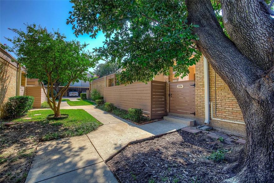 This recently renovated 2 bed 2 bath townhome is situated in the heart of the Dallas metroplex. It offers new quartz bathroom countertops, new bathroom vanity, beautiful new tiled walk in shower, vinyl plank flooring and fresh paint throughout. Downstairs hosts the primary bedroom with ensuite bath, a spacious living room with fireplace and beautiful kitchen. Upstairs is the generous sized second bedroom and bath. The townhome has a private gated courtyard and is just a few steps from the community pool. Close proximity to major Dallas highways. All appliances including fridge and stackable washer and dryer convey with the property.  HOA fees include exterior insurance, water, trash, and grounds maintenance, and full use of facilities.