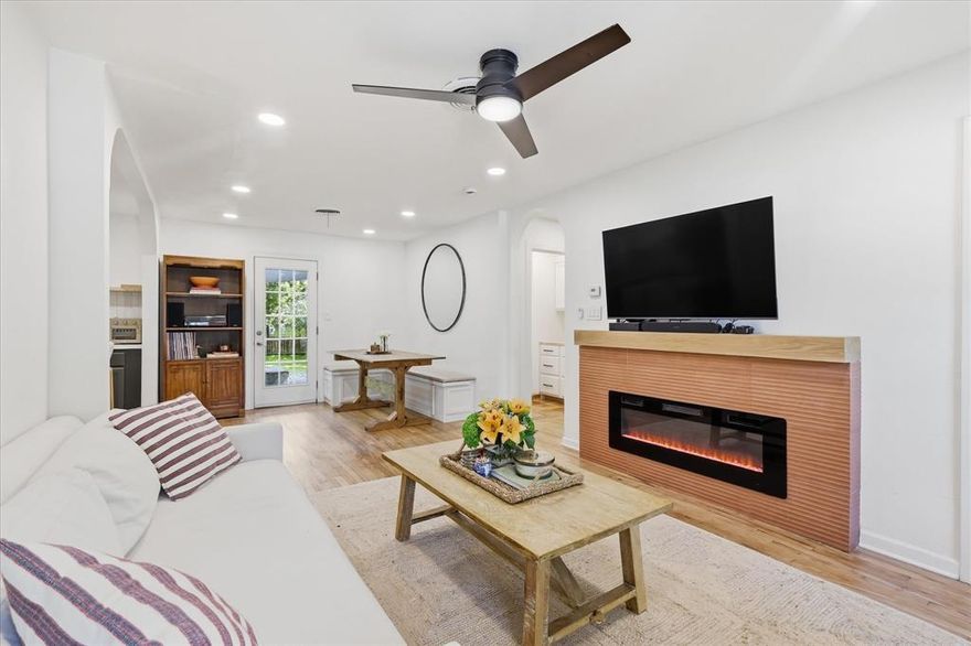 Character, warmth, and a design-forward renovation come together beautifully in this thoughtfully updated Fort Worth gem! Located in the charming Chamberlain Arlington Heights area, this 2-bedroom, 1-bath home delivers personality and authenticity! Original 1947 hardwood floors, Saltillo tile, arched openings, and a striking fireplace addition create a space that feels curated, inviting, and effortlessly livable. Renovated in 2024, updates include all new electrical, plumbing, appliances, paint throughout, a fully redesigned kitchen and bath, decorative lighting, ceiling fan additions, and a roof replacement (2023) - blending modern convenience with timeless character. The kitchen features updated cabinetry, generous prep space, open shelving, an island with seating and drawer storage, and a layout that flows seamlessly into the living and dining areas - ideal for cozy evenings, casual entertaining, or slow weekend mornings with coffee and music playing in the background. The dining area features a custom-built bench,  thoughtfully positioned to overlook the backyard. Natural light pours through the windows, highlighting the home’s warm textures and calming aesthetic. The converted garage, currently functioning as a coffee bar and utility space, offers exceptional flexibility and could easily serve as a creative studio, office, or hobby room—perfect for today’s evolving lifestyle needs. Outside, the backyard offers room to garden, entertain, unwind, or simply enjoy the shade. A charming storage shed with added electricity enhances both functionality and character, while the welcoming front porch and covered back patio create inviting spaces to relax and connect. With its boutique design feel, vintage charm, updated renovation, and proximity to Downtown Fort Worth, the Cultural District, Camp Bowie, and local dining, this property captures a lifestyle that feels creative, comfortable, and distinctly Fort Worth!