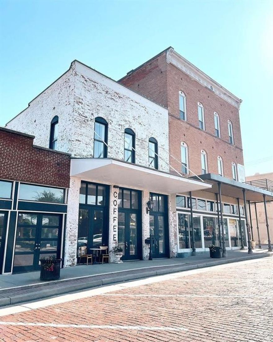 Remarkable 2,400 sqft 2nd floor space above 12 Stories Coffee Parlor in downtown Farmersville, TX which is on the National Historic District registry! Immerse yourself in the charming downtown atmosphere.This 1895 lease space includes original hardwood floors and ceilings that exude timeless elegance. The space has tons of natural light streaming through large, enchanting windows that offer views of downtown. Modern amenities include 2 full bathrooms, shared kitchenette - equipped with sink, dishwasher, fridge and freezer. Layout allows for flexible leasing options: take the entire space at $1800 month. Ideal for natural light photography, yoga, art gallery - studio or office space. This space invites inspiration! Easy 50-minute drive northeast of Dallas. Elevate your business or creative endeavors in a space that merges historical charm with modern functionality. NOTE: No high-impact activities allowed.