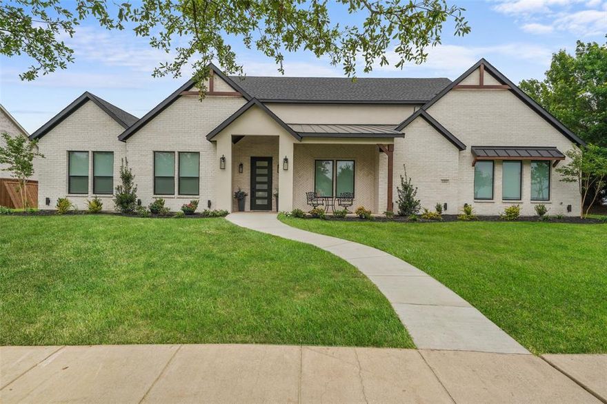 Modern luxury meets thoughtful design in this stunning custom home located in the sought-after Devonshire community in Forney. Located just a short walk from the walking trails that lead to the fountain and duck pond. Situated on an oversized lot with expansive green space, this beautifully crafted residence offers striking curb appeal with clean architectural lines, and a welcoming covered front porch. Inside, soaring vaulted ceilings and an open-concept layout create a bright, airy atmosphere perfect for both everyday living and entertaining. The spacious living room is anchored by a dramatic floor-to-ceiling fireplace with custom built-ins and designer finishes. The gourmet kitchen features an oversized island, quartz countertops, custom cabinetry and hidden walk-in pantry, premium appliances, elegant lighting, and abundant prep space. Retreat to the luxurious primary suite showcasing a tray ceiling, spa-inspired ensuite bath, and a calming designer aesthetic. Additional bedrooms offer flexibility for guests, office space, or multi-generational living. Stylish finishes continue throughout with modern fixtures, clean lines, and elevated details in every room. Step outside to enjoy the oversized covered patio overlooking a large backyard with endless possibilities for entertaining, play, or future pool plans. Located in a desirable neighborhood with convenient access to shopping, dining, schools, and major highways, this exceptional property offers both luxury and lifestyle in one beautiful package.