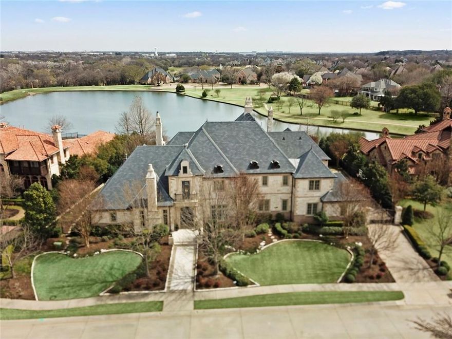 From the moment you enter this fabulous estate the breathtaking water views will leave you awe-struck! Enjoy the lush grounds & stunning view of the infinity edge pool that seamlessly blends with the backdrop of the lake.  Filled with the finest appointments including extensive hardwood & stone flooring, Control 4 Smart Home Automation, 6 fireplaces, exquisite millwork, high ceilings with lighted domes,  luxurious master suite with a coffee bar and a spa-like bath retreat with a sauna! The backyard oasis offers an outdoor living area with fireplace, Lynx grill, an outdoor firepit and automated landscaped lighting. Private exercise room off upstairs balcony. A fine estate in the premier gated Tanglewood Estates!