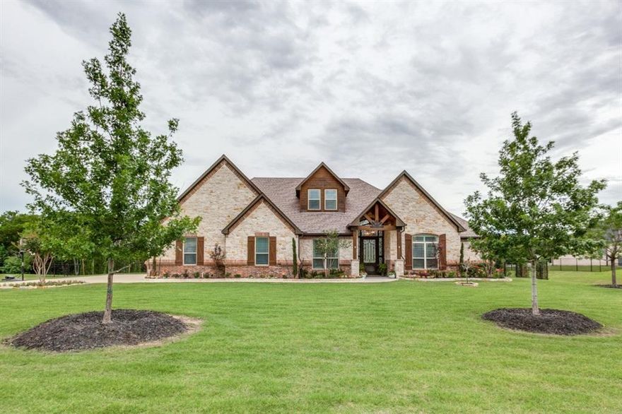 Located in the highly coveted The Falls of Sunnyvale on over an acre. This elegantly designed home has over 4300 square feet of custom features including a gorgeous stone fireplace in the living room with rich hardwood floors and custom cabinetry throughout. The exquisite kitchen with an abundance of counter space and storageis a chefs dream. The kitchen has a large island that opens up to the living room and a wall of windows overlooking the resort style backyard with a pool and spa complete with a custom slide and outdoor living area with an electric shade. The oversized master suite has his and hers seperate vanities, a large walk in tile shower and tub! Upstairs is the perfect retreat for the kids with two large bedrooms, a gameroom and a media room! You must see to appreciate the detail to perfection in this home from the custom cabinets to the beautiful flooring!