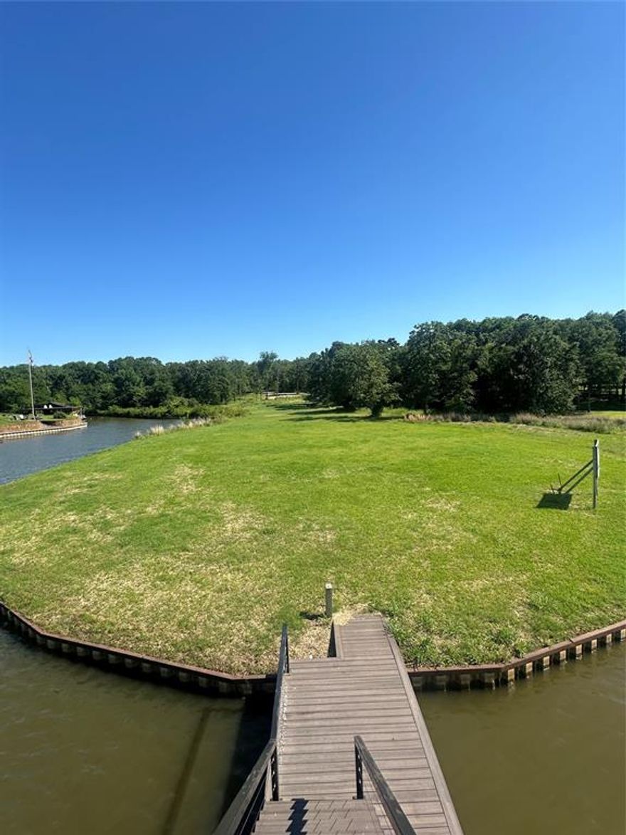 Build your dream full time or second home on this Secluded 4 acre waterfront Property in a Gated Community. Retaining wall in place - Newer Boathouse. July of 2024 New house pad was built - Electricity Ran to build site - Water Meter installed and waterline ran to build site - New Septic System installed, Only thing missing is your dream home.